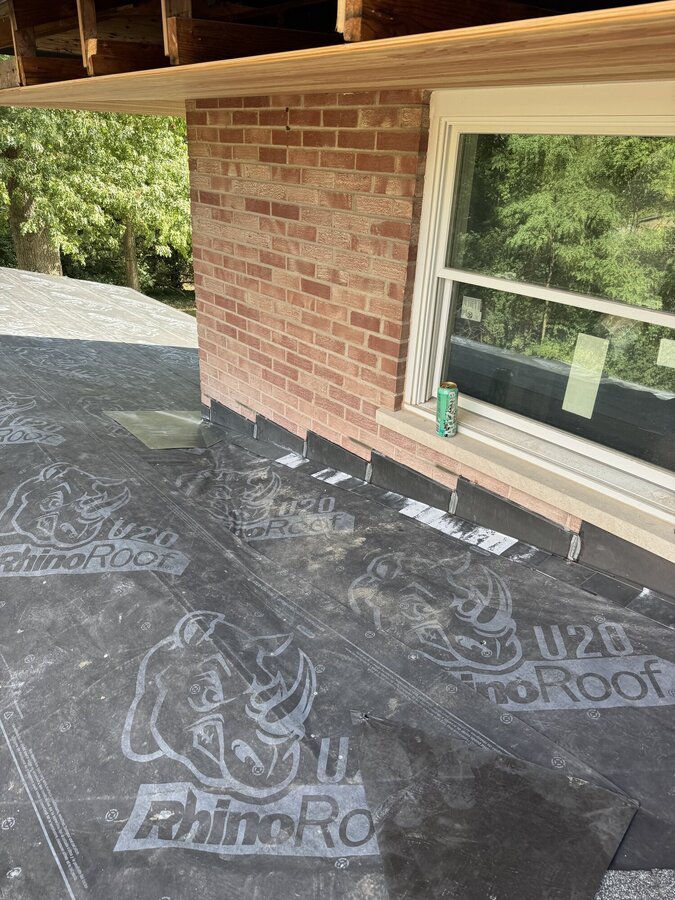 Step flashing at chimney wall