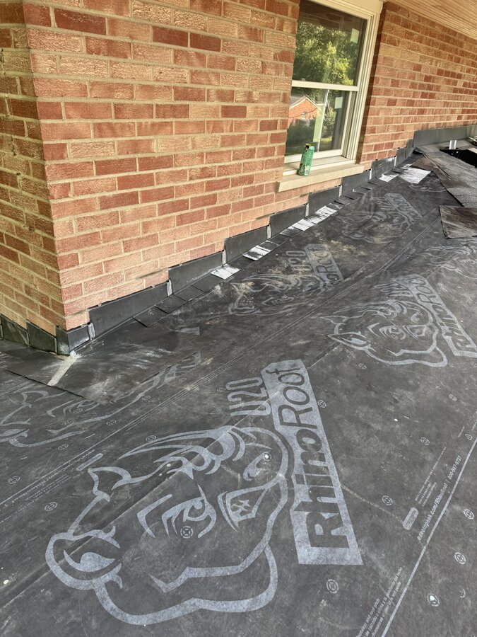 Step flashing chimney base
